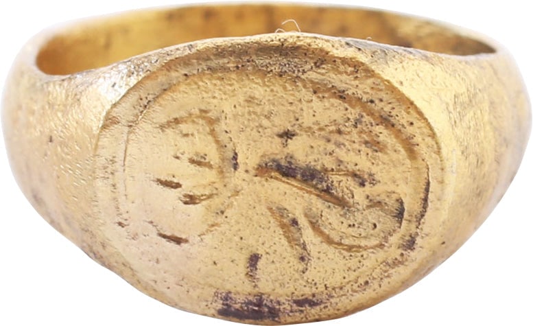 ROMAN WOMAN’S RING C.100-400 AD SIZE 3: Gilt bronze, size 3 for the small finger as was the custom. 3.8mm rounded face band flaring to the shoulders. Bordered oval bezel cut with an abstracted figure, evidently a scorpion. The scorpion was