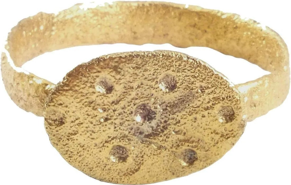 GOOD EUROPEAN PILGRIM'S RING, SIZE 10 3/4: Large size 10 3/4. 8th-9th Century AD. Gilt bronze with oval bezel impressed with seven pips in a matrix. That motif is a later incarnation of the five wounds of Christ, found on earlier rings. At