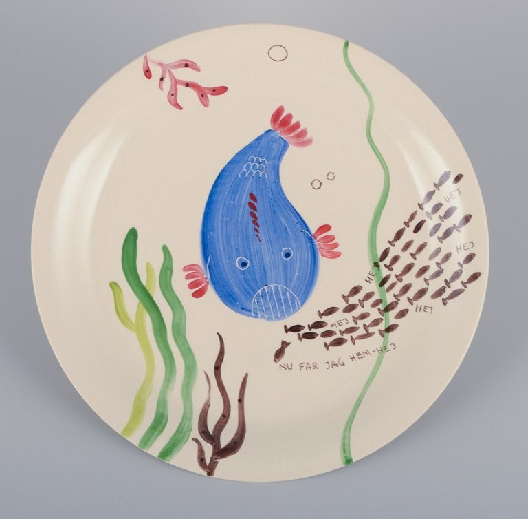 Stig Lindberg for Gustavsberg. "Löja" plate. Hand-painted with a fish motif. Satirical: Title: Stig Lindberg for Gustavsberg. "Löja" plate. Hand-painted with a fish motif. Satirical illustration with Swedish text. Description: Stig Lindberg for Gustavsberg. "Löja" plate. Hand-p