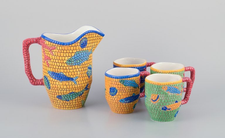 Vietri, Italy. Set of four large mugs and a large pitcher in ceramic. Decorated with fish and sea: Title: Vietri, Italy. Set of four large mugs and a large pitcher in ceramic. Decorated with fish and sea motifs in a mosaic-like pattern. Description: Vietri, Italy. Set of four large mugs and a large