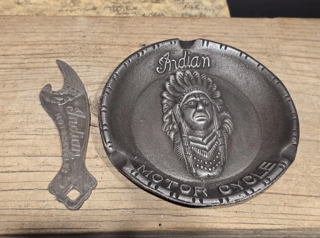 Indian Motorcycle Ash Tray and Bottle Opener Set: Tray is 5 1/2" Wide Wonderful reproduction collectible Indian Motorcycle ash tray and bottle opener. Advertising pieces like this many times were given to shops or used. Such a neat piece. Reserve: $