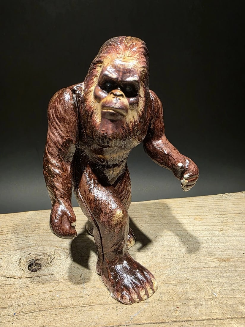 7 1/2" Cast Iron Big Foot Sasquatch Coin Bank: 7 1/2" Tall Great reproduction cast iron coin bank. All cast iron hand painted, slightly distressed as shown in the images. Certainly looks old! Reserve: $35.00 Shipping: Domestic: Flat-rate