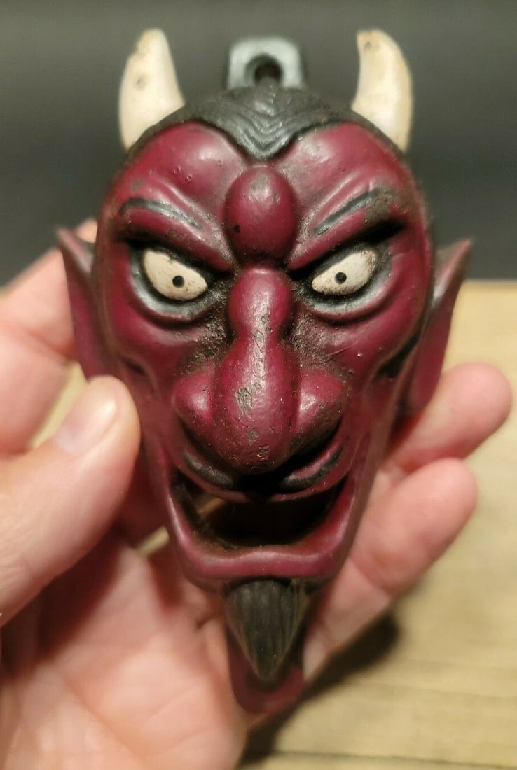 Cast Iron folk art Devil Wall mount Bottle Opener: 5 3/4" Tall x 4" Wide Great reproduction cast iron bottle opener. This piece was made to look just like an antique, but is new. Reserve: $22.00 Shipping:Domestic: Flat-rate of $8.00 to