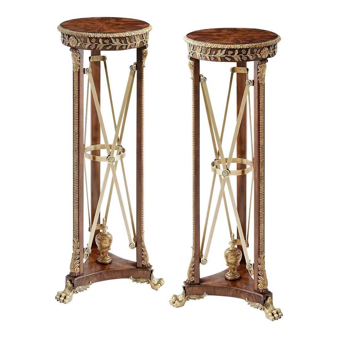 Pair of Regency Style Pedestals: A fine pair of pedestals or carved and gilt torchères, the circular top with a carved edge and frieze, on three supports with acanthus bases and capitals, the whole supported on a trefoil