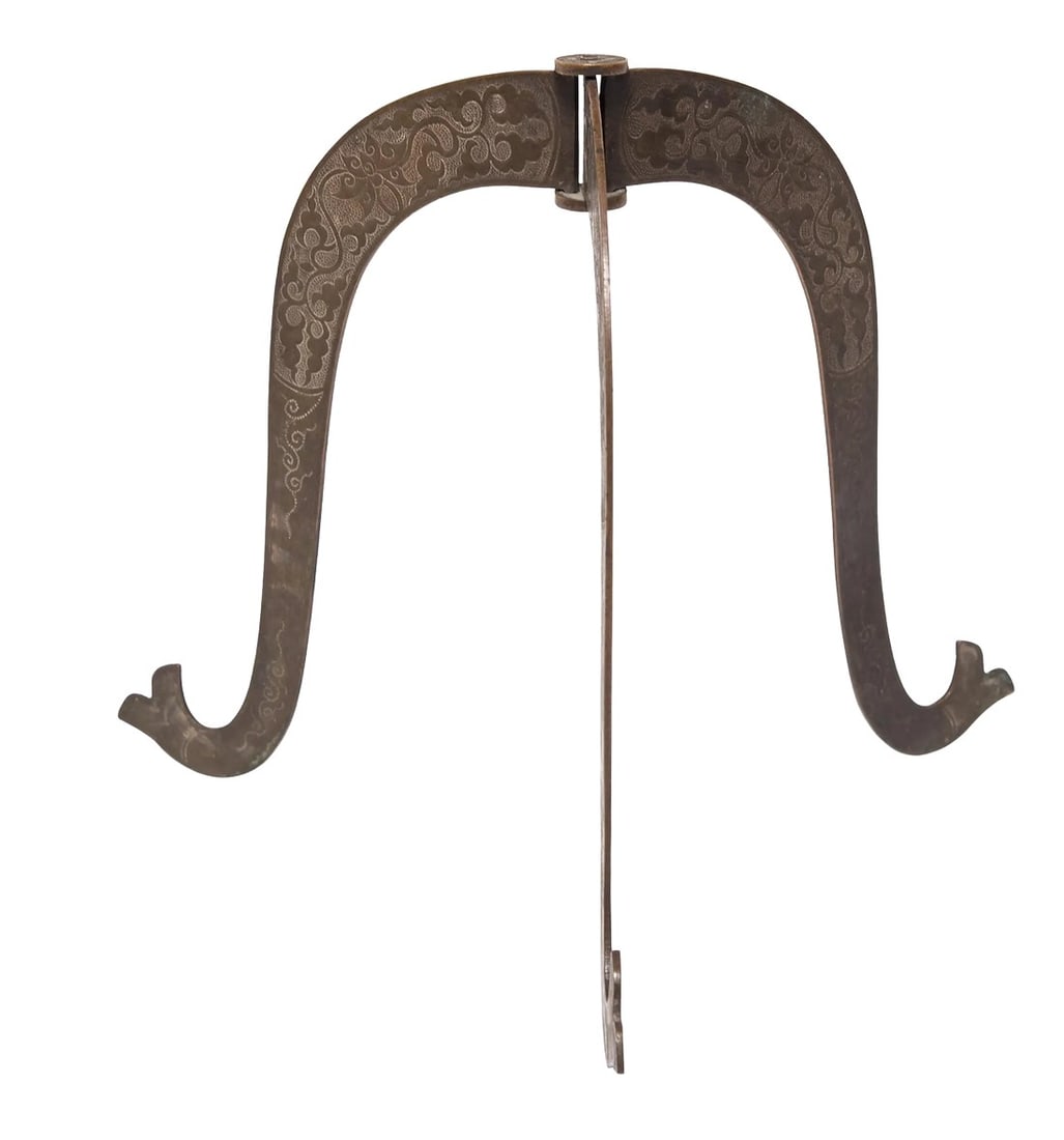 Chinese Baitong Etched Folding Hat Stand, c. 1850: A Qing dynasty official proclaimed his rank through badges and accessories including his hat. This ingenious folding white brass hat stand, covered in intricately etched scrollwork, recalls the time