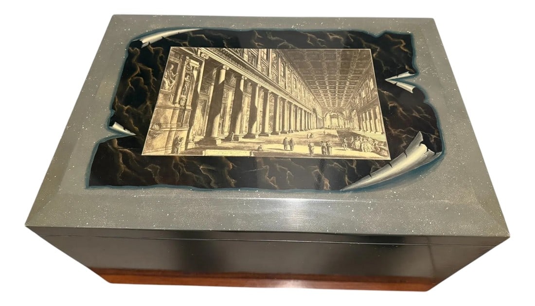 Maitland Smith Lacquered Storage Trunk With Piranesi Print: Quick Hits: Maitland-Smith lacquered storage trunk with Piranesi print Hand-painted finish with a neoclassical architectural motif Ebony interior and brass-tone hinge Functional as a coffee table,