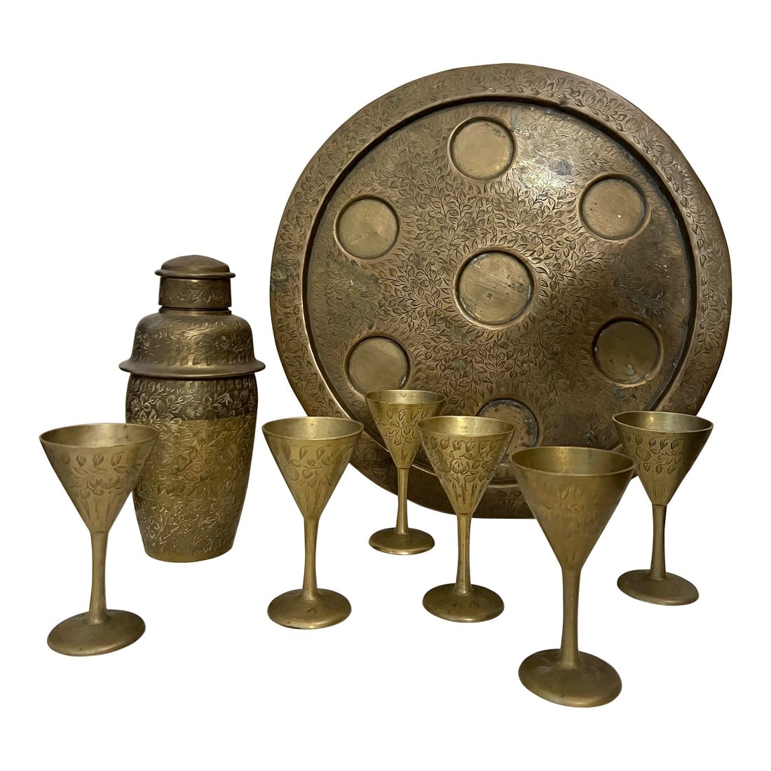 1930s Vintage Cocktail Shaker Set Brass Liquor Set: Vintage Brass Cocktail Shaker Set with 6 Stemmed Glasses & Tray. This Art Deco 1930s India brass set is heavily Decorated with engraved flowers and leaves. Rare art nouveau Indian Brass Martini