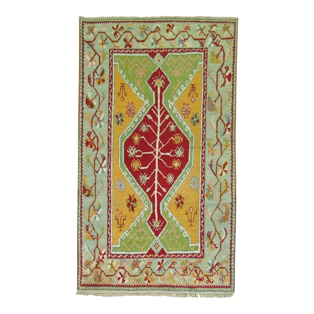 Early 20th Century Antique Turkish Ghiordes Rug: Accent size Turkish Ghiordes rug featuring bright vibrant colors. Measures: 3'9'' x 6'. Condition: Alterations: Original Condition Unaltered Imperfections: Some Imperfections Condition Notes: Good Dim