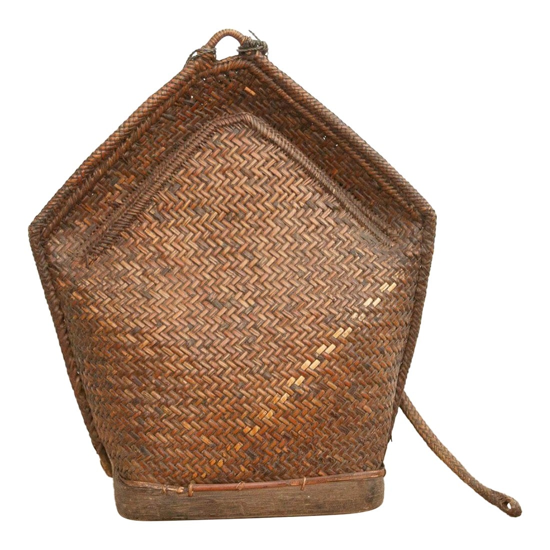 Large Antique Borneo Woven Harvest Carrier: A masterpiece of functional design, this antique woven backpack was originally crafted for the rigors of mountain life in Southeast Asia. Known as a harvest carrier, it is constructed from tightly pla