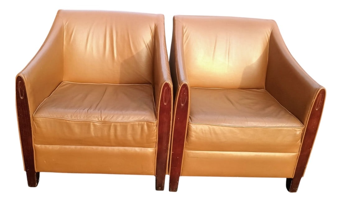 Elevate Any Living Space With This Magnificent Pair of Rare Vintage Paoli Club Chairs: Upholstered in a rich, cognac-toned leather, these chairs exude an air of opulence and refinement, making them a true statement piece. Key Features: Classic Design: Featuring the clean lines, wide,