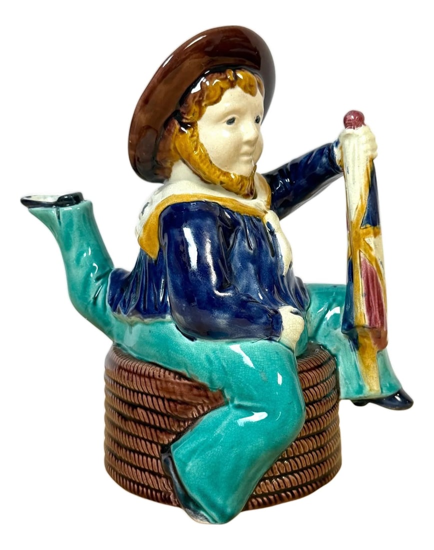 Victorian Majolica "Three-Legged Sailor" Teapot, Attributed William Brownfield: Victorian Majolica "Three-Legged Sailor" Teapot, Attributed to William Brownfield & Sons, c. 1880 Dimensions: 9" H × 7" W × 5" D This rare and engaging Victorian majolica teapot is modeled