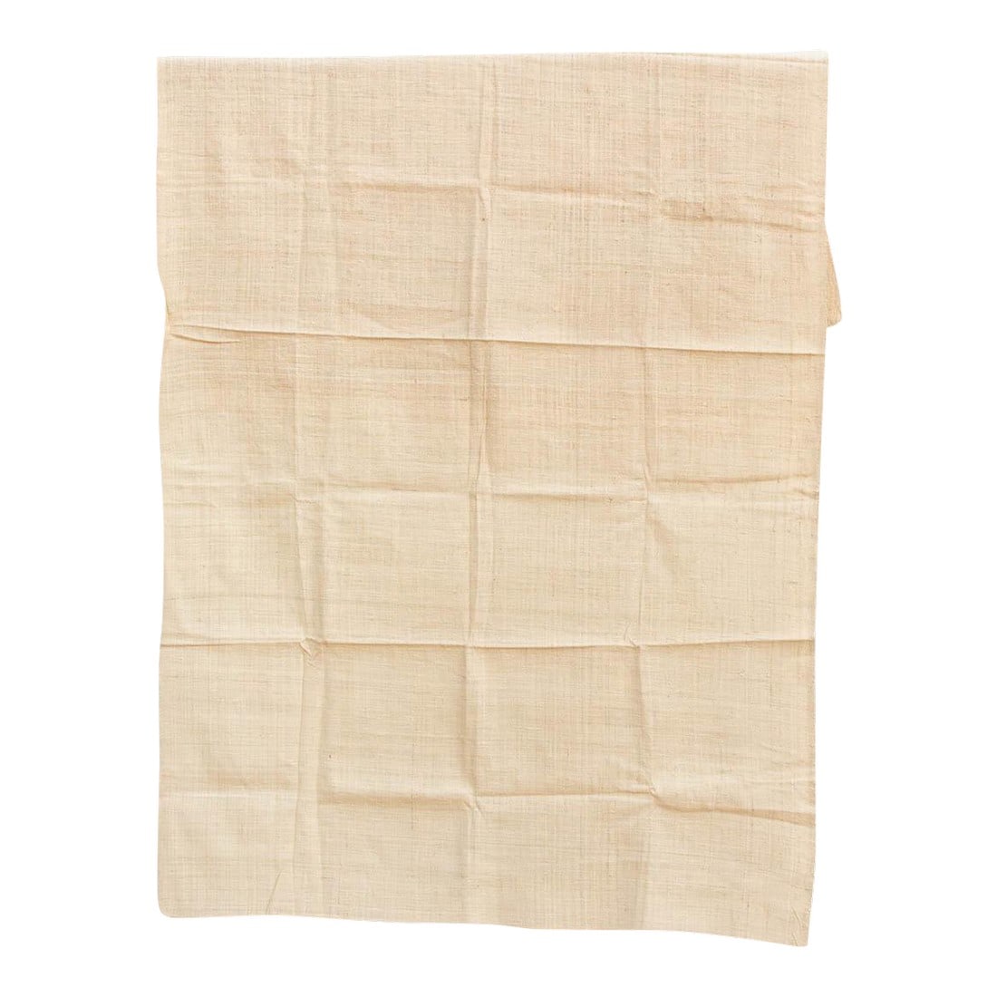 Organic Peace Silk Throw, Sandstone: The purest expression of the material itself. These throws are crafted from Undyed or Lightly Tinted Eri Silk, celebrating the raw, organic beauty of the fiber. Without heavy dyes to mask it, the hand