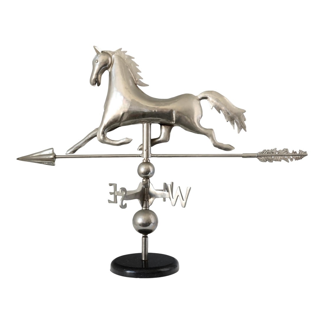 Horse Weathervane on Base: A beautifully sculpted horse weather vane, rendered in polished metal and mounted on a sleek black marble base. Inspired by 19th-century American rooftop vanes that once adorned barns and cupolas,