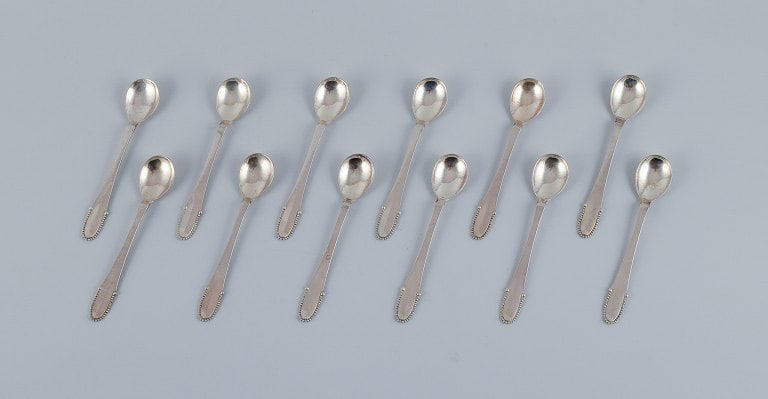 Georg Jensen Beaded. A set of twelve coffee spoons in sterling silver.: Title:Georg Jensen Beaded. A set of twelve coffee spoons in sterling silver. Description:Georg Jensen Beaded. A set of twelve coffee spoons in sterling silver. Post 1945 hallmark. In excellent conditi