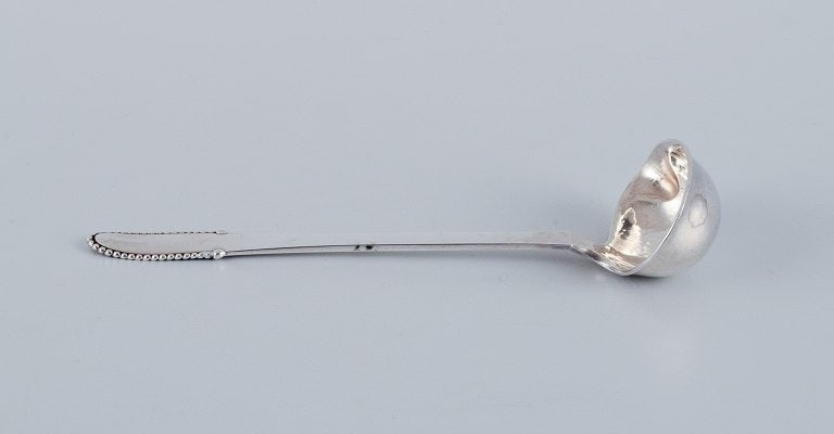 Georg Jensen Beaded. Butter sauce spoon in sterling silver.: Title:Georg Jensen Beaded. Butter sauce spoon in sterling silver.Description:Georg Jensen Beaded. Butter sauce spoon in sterling silver. Post-1945 hallmark. In excellent condition. Dimensions: L 13.0