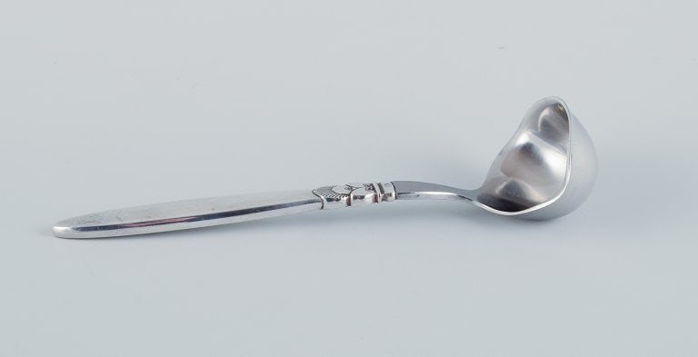 Georg Jensen, Cactus, a sterling silver and stainless steel sauce spoon. (1 of 4)