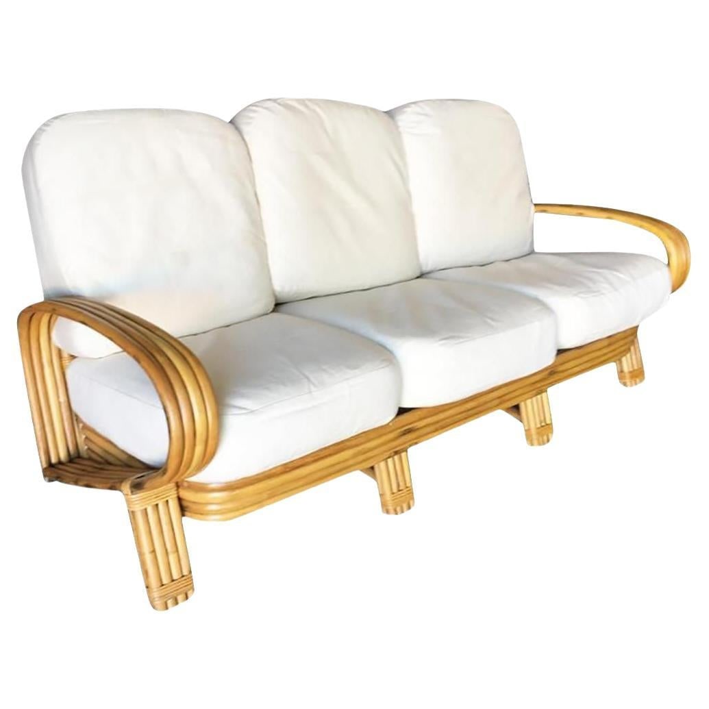 Restored Quad Pole "R" Arm 3 Seat Rattan Sofa: Title: Restored Quad Pole "R" Arm 3 Seat Rattan Sofa Description: Rare "R" arm rattan 3 seater sofa with "Quad Pole" design featuring 4 strand rattan arms, legs, and 4 pole base. 1950, United States