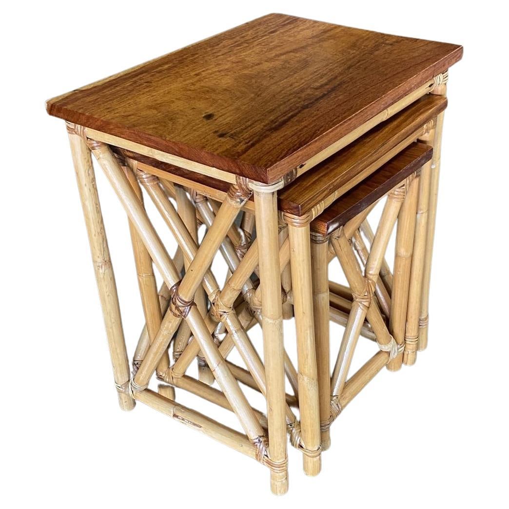 Restored Set of 3 Rattan Nesting X Side Tables with Mahogany Top: Title: Restored Set of 3 Rattan Nesting X Side Tables with Mahogany Top Description: A wonderful set of 3 Rattan nesting tables with inset mahogany tabletops. The Rattan used for these nesting tables