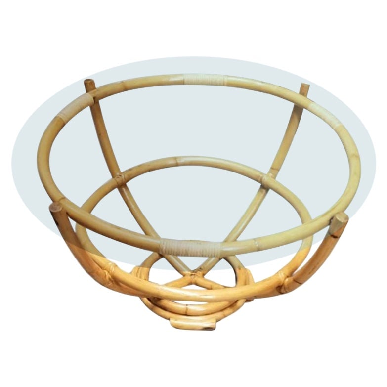 Restored Rattan Glass Top Coffee Table: Title: Restored Rattan Glass Top Coffee Table Description: This beautifully restored Paul Frankl-inspired rattan coffee table, crowned with a sleek glass top, embodies timeless charm and modern simpli