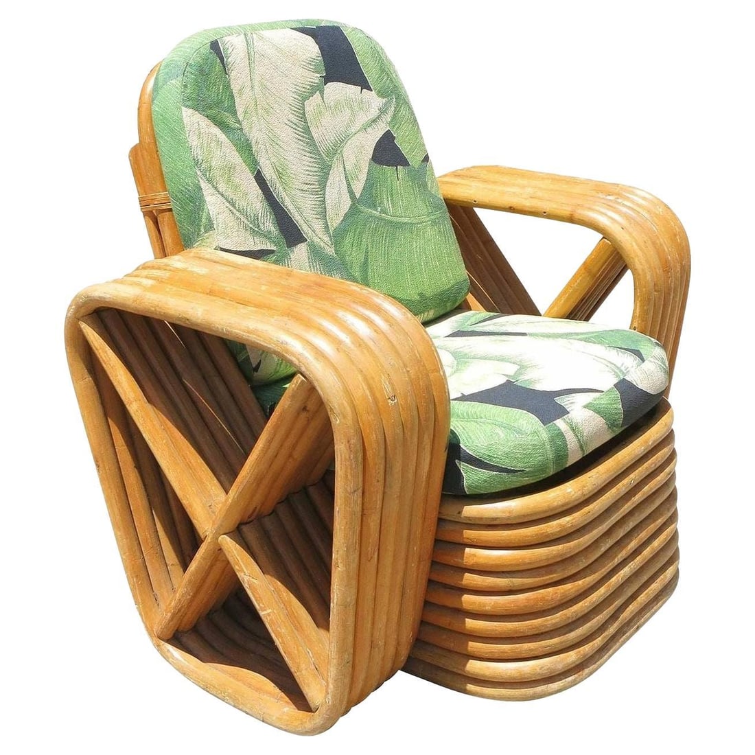 Restored Paul Frankl Square Pretzel Rattan Children's Lounge Chair: Title: Restored Paul Frankl Square Pretzel Rattan Children's Lounge Chair Description: Child size Paul Frankl lounge chair, this chair features six-strand square pretzel arms with a Classic stacked ba