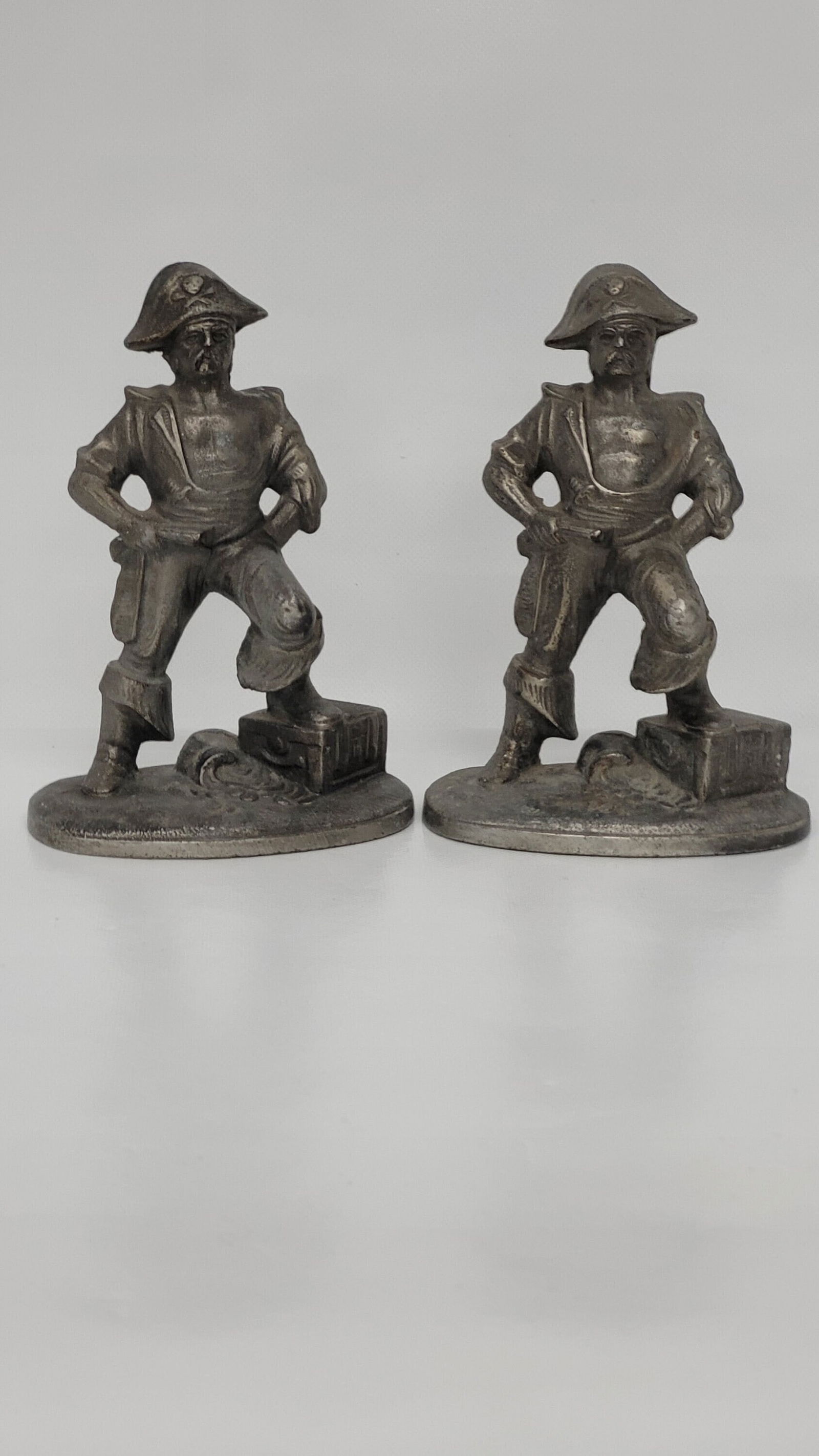 Vintage Pirate Statues Bookends Cast Iron book holders Brushed Silver Pewter 5.5"H: Title: Vintage Pirate Statues Bookends Cast Iron book holders Brushed Silver Pewter 5.5"H Description: Vintage from the 1920s Materials: cast, metal, spelter Width: 4 inches Height: 5.5 inches