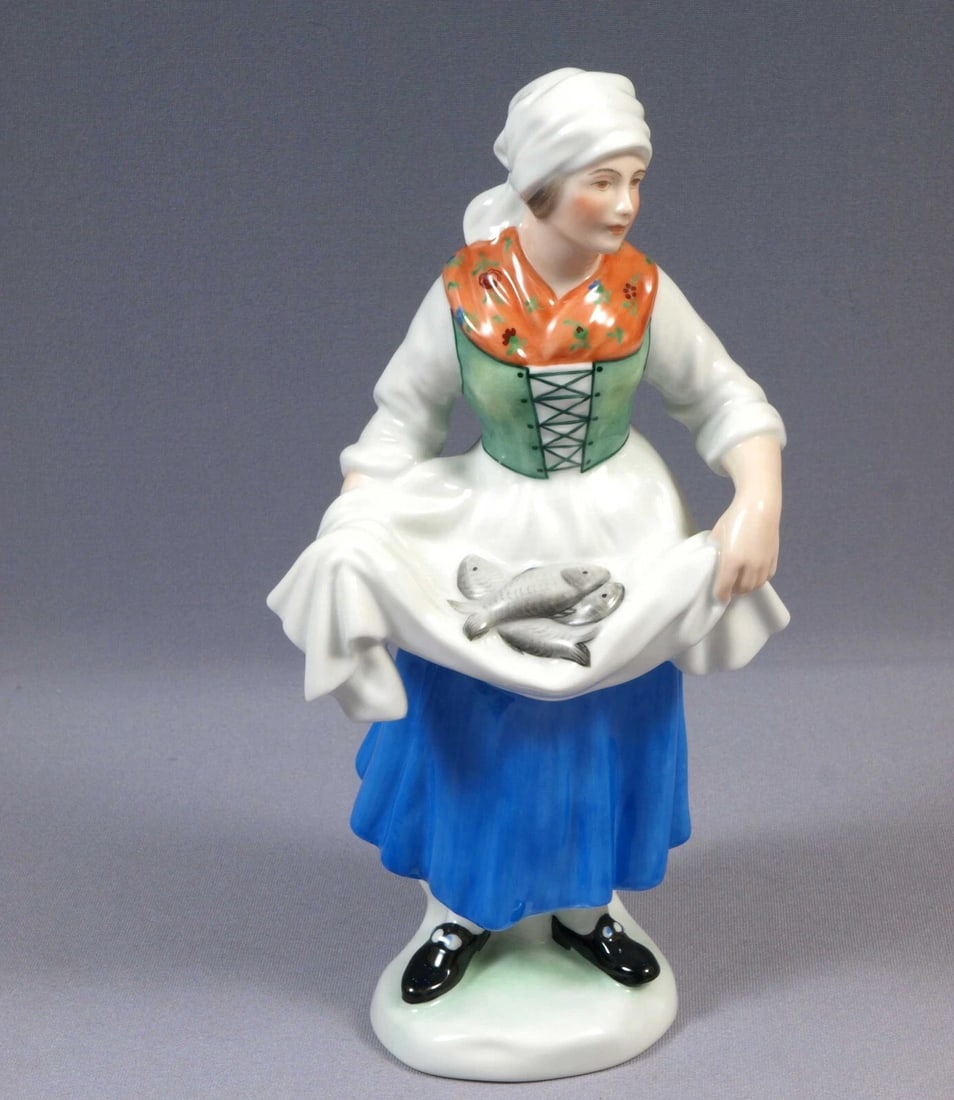 Herend Hungary Woman Fishmonger Fish Seller Figurine 5703 LARGE 10 3/8": Title: Herend Hungary Woman Fishmonger Fish Seller Figurine 5703 LARGE 10 3/8"Description: . This is an exceptional Figurine made by Herend in Hungary. The figurine is marked with Herend older