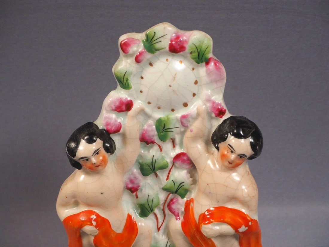 STAFFORDSHIRE Figurine 19 Century two naked boys cherubs clock c 1855: Title: STAFFORDSHIRE Figurine 19 Century two naked boys cherubs clock c 1855 Description: . This is a beautiful Staffordshire figurine that depicts cherubs/boys standing under a clock. The figurine is