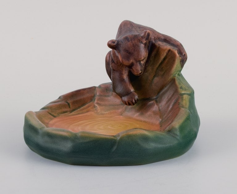Ipsen's Enke, small dish with crawling bear.: Title: Ipsen's Enke, small dish with crawling bear. Description: Ipsen's Enke, small dish with crawling bear. 1920/30s. Model number 222. In excellent condition. Marked. Dimensions: H 8.0 x D 11.5 