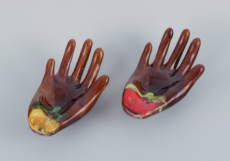 Vallauris, France, a pair of ceramic bowls shaped like hands in brightly colored glazes.: Title: Vallauris, France, a pair of ceramic bowls shaped like hands in brightly colored glazes. Description: Vallauris, France, a pair of ceramic bowls shaped like hands in brightly colored glazes.