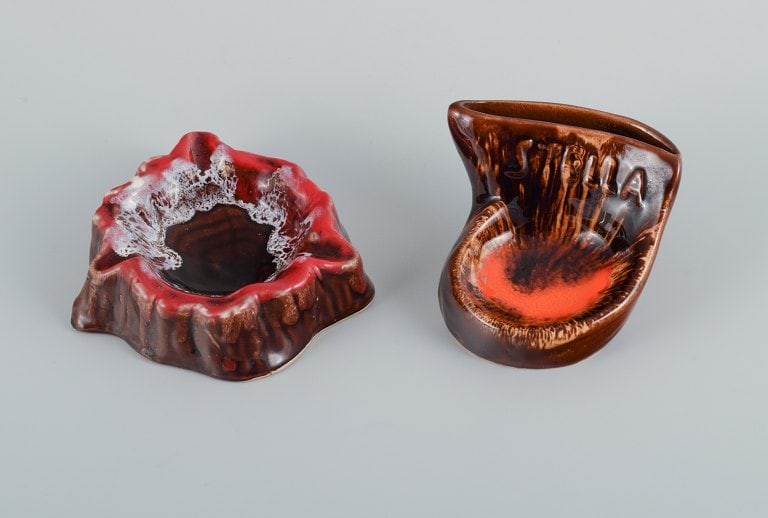 Vallauris, France, two ceramic bowls in brightly colored glazes in red and orange on a dark brown (1 of 7)