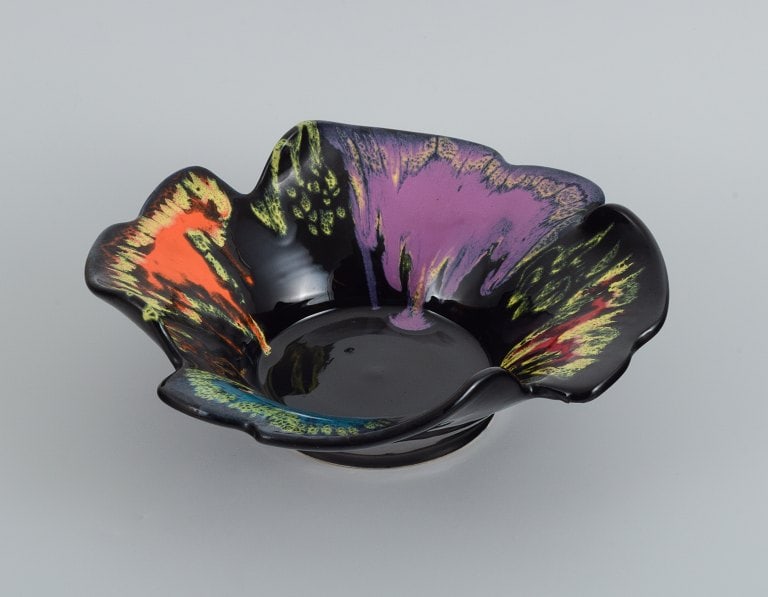 Vallauris, France, ceramic bowl in brightly colored glazes on a black base. (1 of 7)
