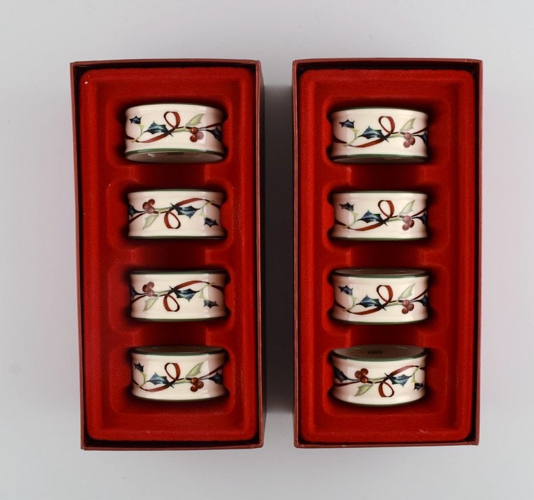 Catherine McClung for Lenox. "Winter greetings everyday". Eight napkin rings in glazed stoneware: Title: Catherine McClung for Lenox. "Winter greetings everyday". Eight napkin rings in glazed stoneware decorated with mistletoe and red ribbon. Approx. 2000. Description: Catherine McClung for