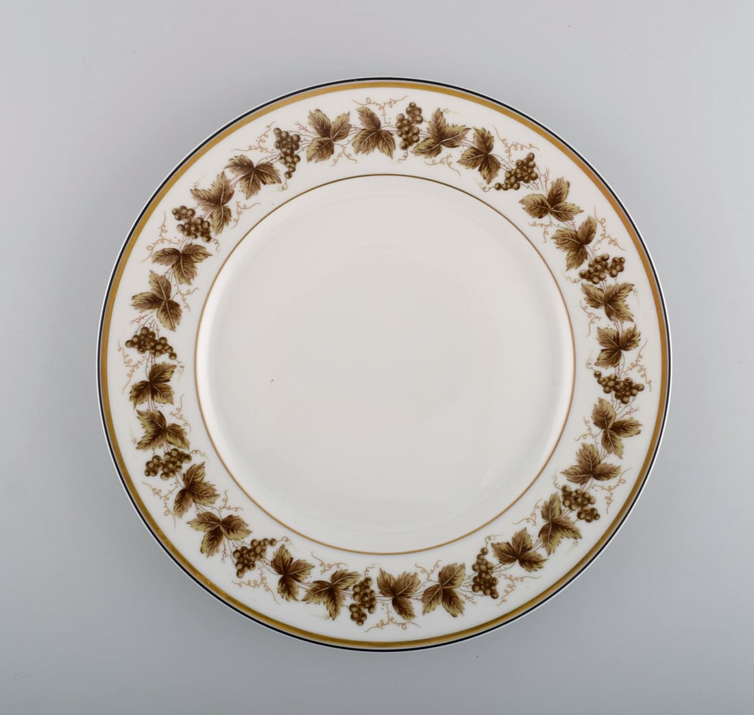 Three large Limoges porcelain plates with hand-painted grape vines and gold decoration. 1930s / 40s. - 2