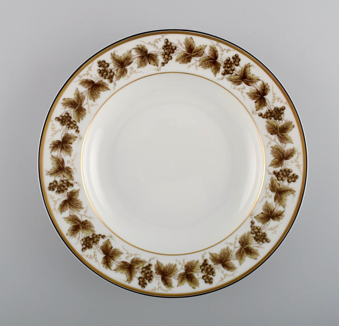 12 Limoges porcelain deep plates with hand-painted grape vines and gold decoration. 1930s / 40s. - 2