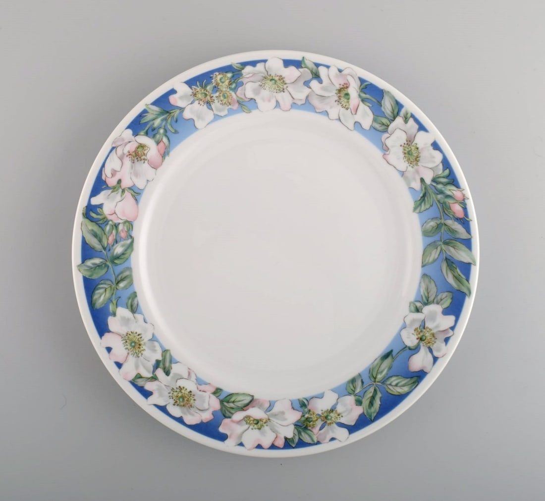 Four Royal Copenhagen White Rose dinner plates with blue border, white flowers and foliage. Dated - 2