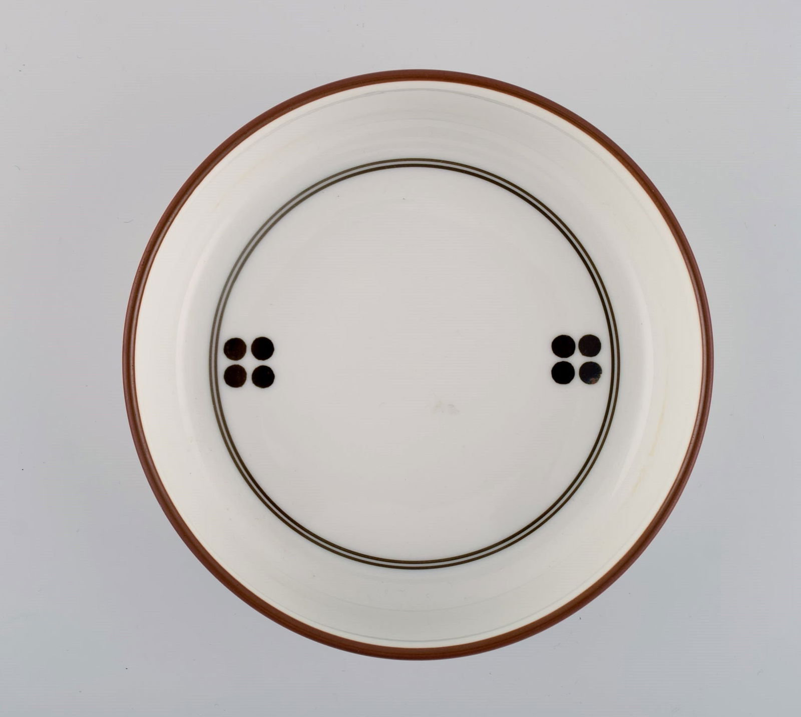 Anne Marie Trolle for Royal Copenhagen. Brown Domino bowl in hand-painted porcelain. Dated (1 of 5)