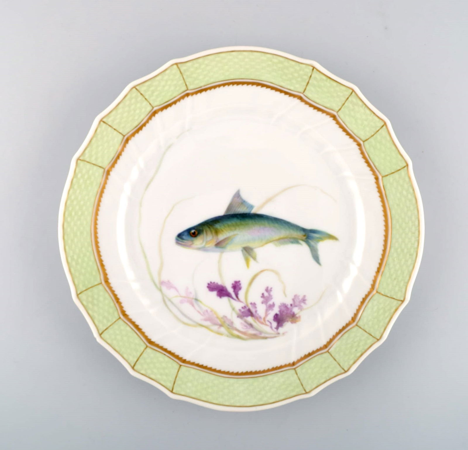 Royal Copenhagen fish plate with green edge, gold decoration and fish motif. Model 919/1710. (1 of 4)