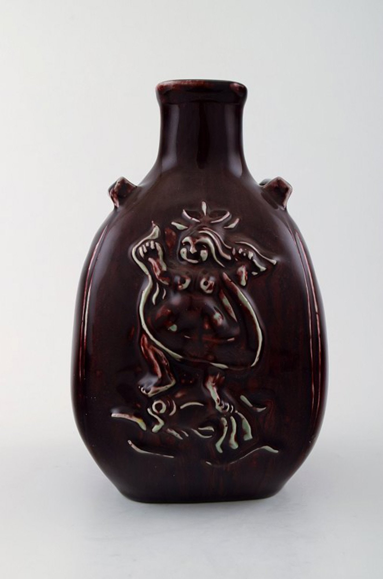 Royal Copenhagen Jais Nielsen ceramic vase in ox blood glaze.: Title: Royal Copenhagen Jais Nielsen ceramic vase in ox blood glaze. Description: Royal Copenhagen Jais Nielsen ceramic vase in ox blood glaze. Stamped with the 3 blue waves for Royal Copenhagen.
