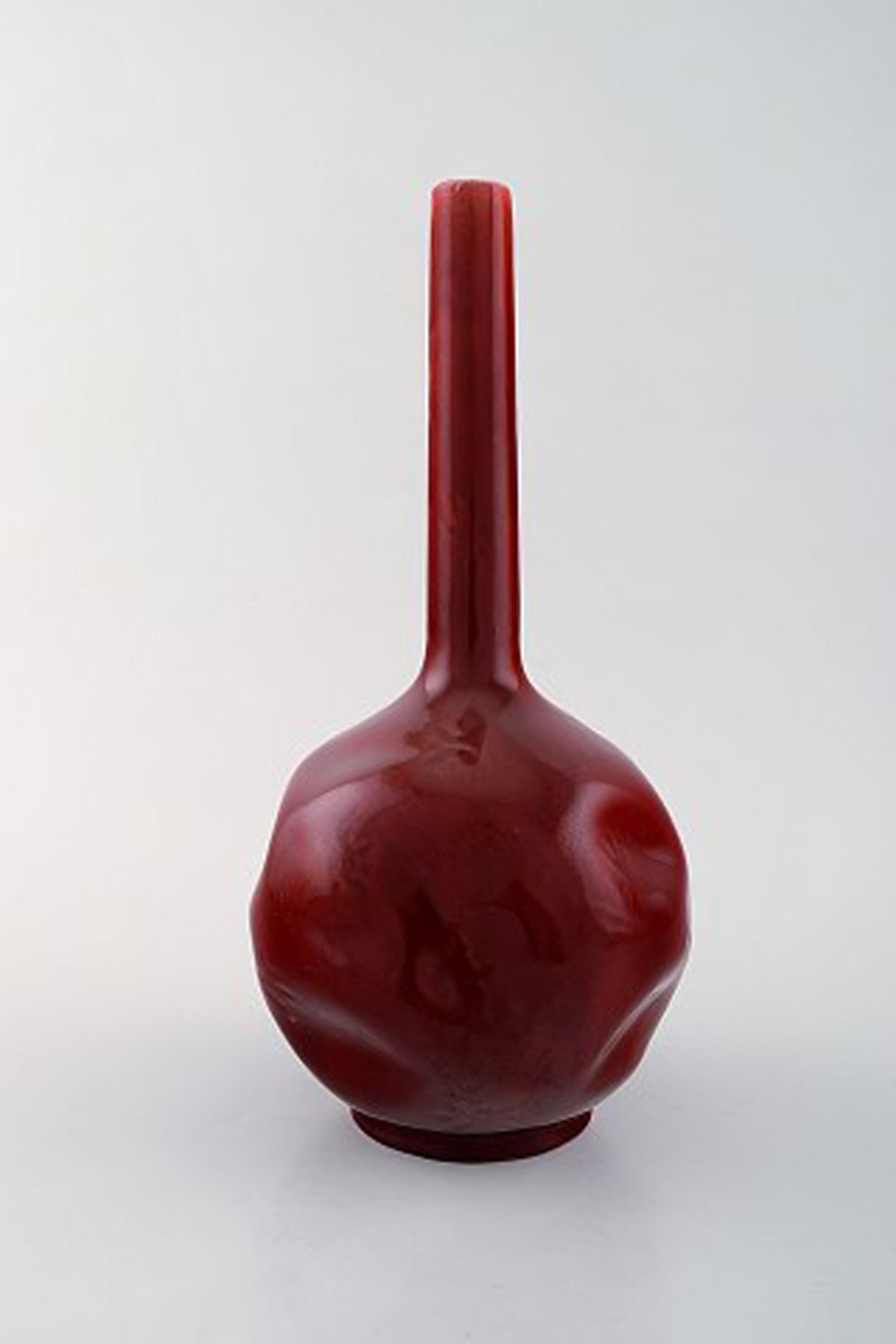 Rörstrand, Sweden. Early vase with narrow neck in glazed faience. Beautiful deep red glaze. Ca. - 2