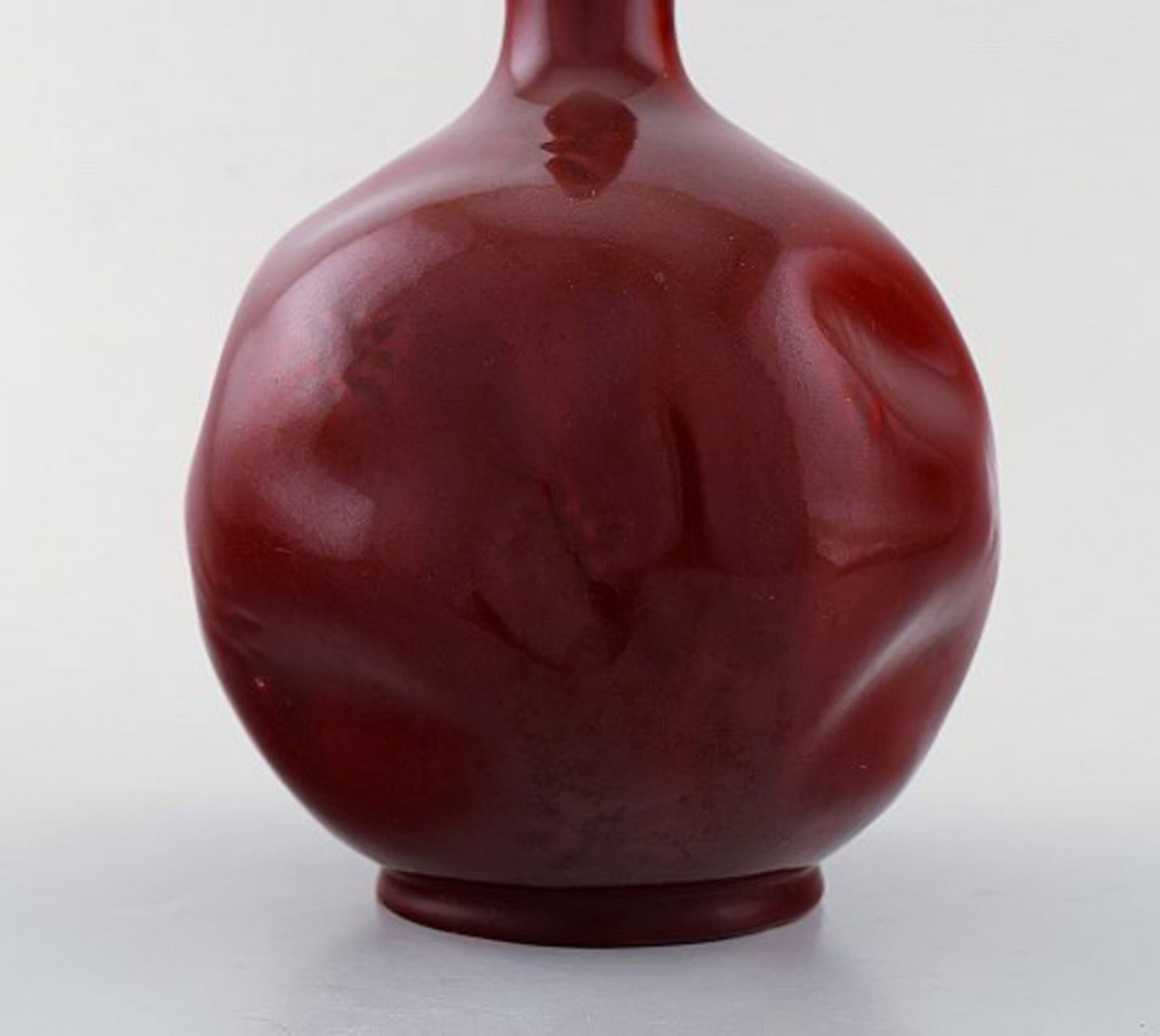Rörstrand, Sweden. Early vase with narrow neck in glazed faience. Beautiful deep red glaze. Ca. - 4