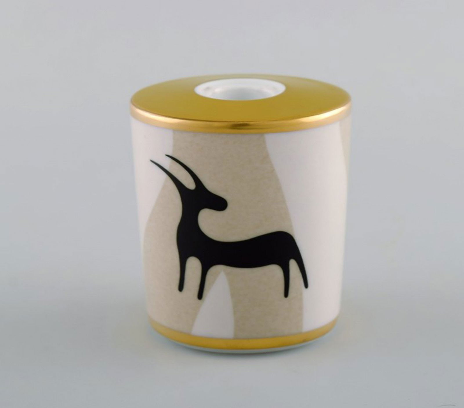 Bvlgari / Bulgari for Rosenthal. "Pascolo Rupestre" candle holder in porcelain. Animal motif and: Title: Bvlgari / Bulgari for Rosenthal. "Pascolo Rupestre" candle holder in porcelain. Animal motif and gold decoration. Late 20th century. Description: Bvlgari / Bulgari for Rosenthal. "Pascolo