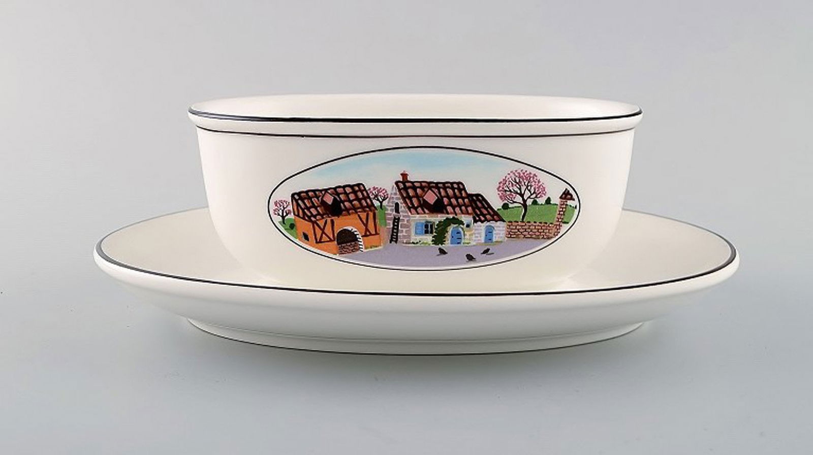 Villeroy & Boch Naif gravy boat on stand in porcelain decorated with naivist village motif.: Title: Villeroy & Boch Naif gravy boat on stand in porcelain decorated with naivist village motif. Description: Villeroy & Boch Naif gravy boat on stand in porcelain decorated with naivist village