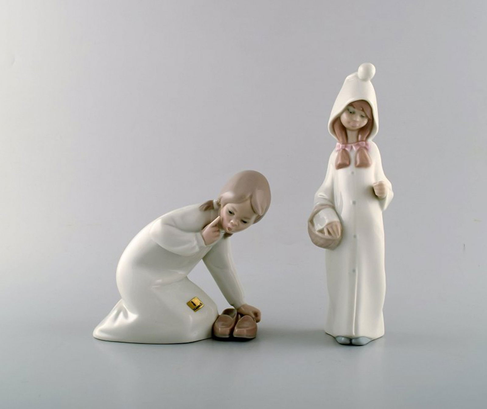 Lladro, Spain. Two child figures in glazed porcelain. 20th century. (1 of 4)