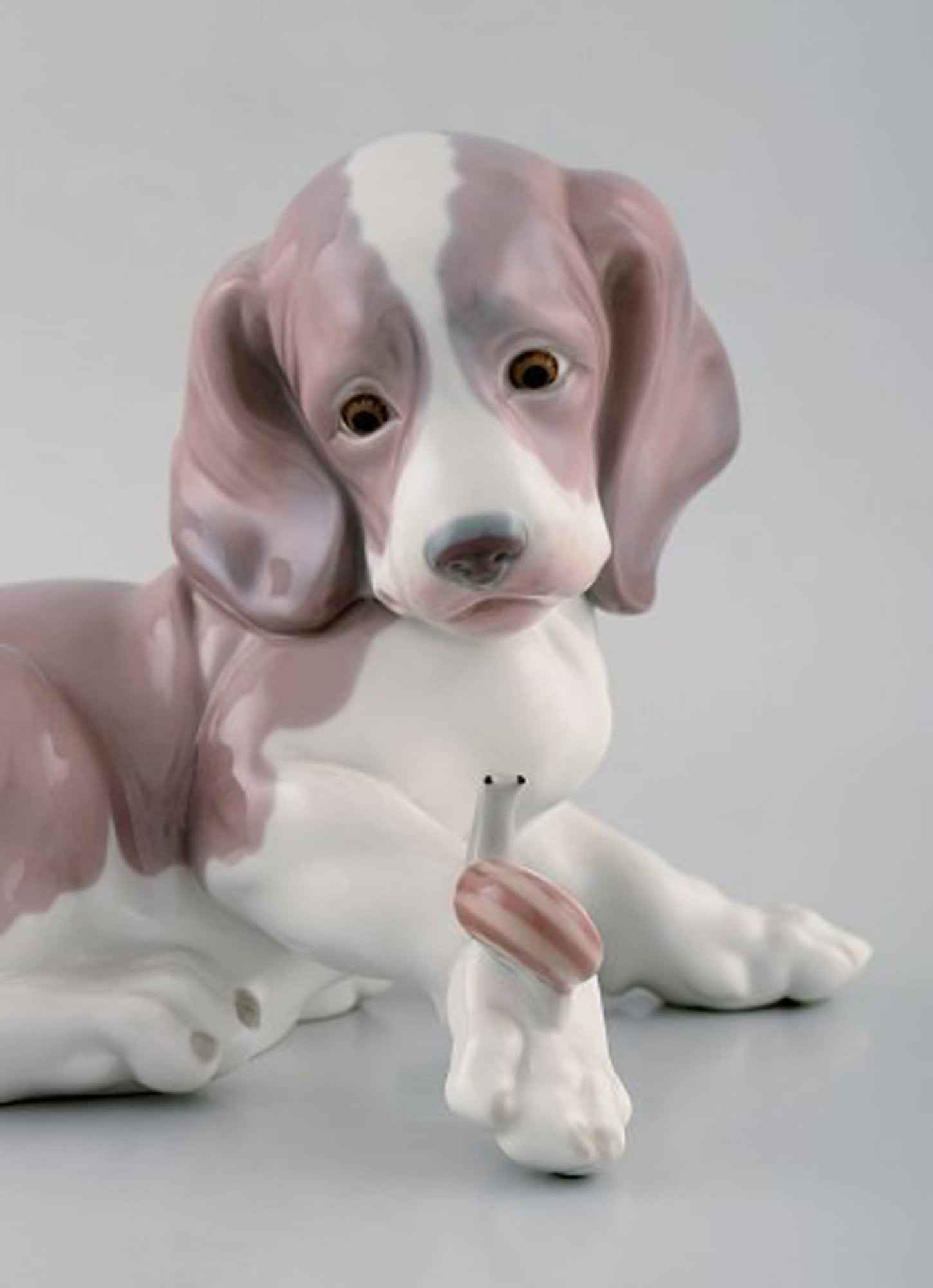 Lladro, Spain. Figure in glazed porcelain. Puppy and snail. 1980's. - 2