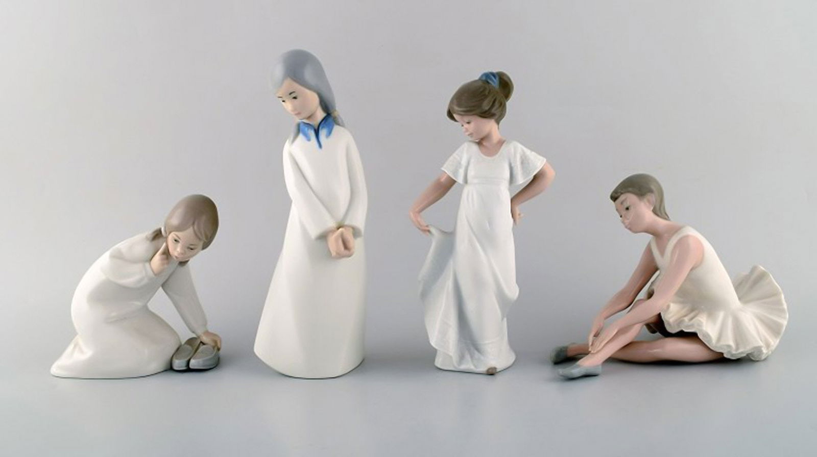 Lladro, Nao and Rex, Spain. Four porcelain figurines of young girls. 1970/80's. (1 of 10)