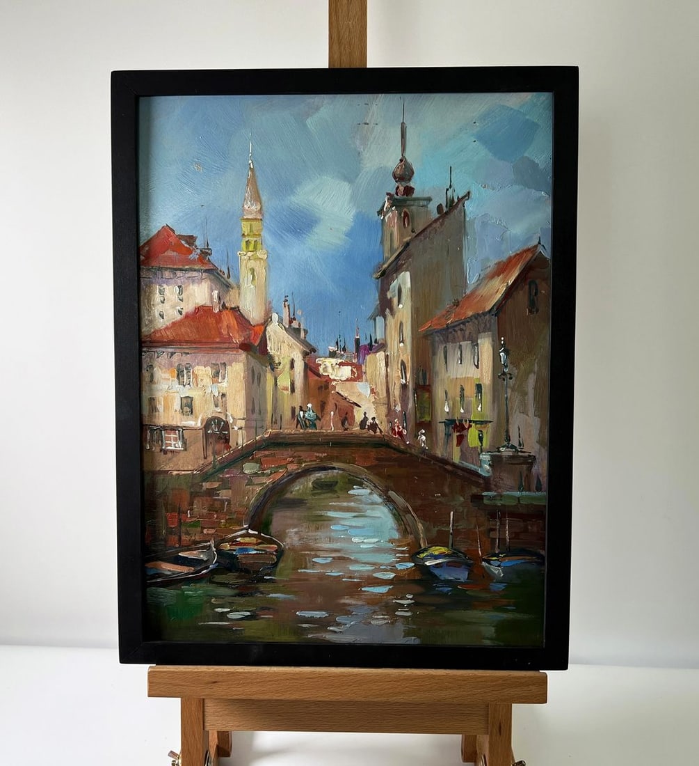 Oil painting City with a river Yuriy Suprunchuk: Title: Oil painting City with a river Yuriy Suprunchuk Description: NoAAA5674The Oil painting Cardboard titled "City with a river" is a poetic depiction of an old European town, alive with history, ch
