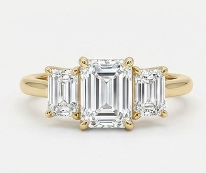 6 Ct Lab Grown Diamond Emerald Cut Three-Stone Ring in 14K Yellow Gold: Title: 6 Ct Lab Grown Diamond Emerald Cut Three-Stone Ring in 14K Yellow Gold Description: Stunning 6 carat lab grown diamond ring featuring a Emerald Cut Three-Stone design. The center stone is
