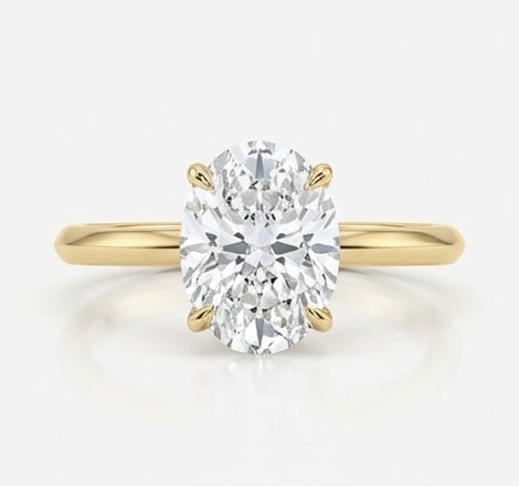5 Ct Lab Grown Diamond Oval Classic Solitaire Ring in 14K Yellow Gold: Title: 5 Ct Lab Grown Diamond Oval Classic Solitaire Ring in 14K Yellow Gold Description: Stunning 5 carat lab grown diamond ring featuring a Oval Classic Solitaire design. The center stone is beautif