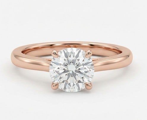4 Ct Lab Grown Diamond Round Solitaire Ring in 14K Rose Gold: Title: 4 Ct Lab Grown Diamond Round Solitaire Ring in 14K Rose Gold Description: Stunning 4 carat lab grown diamond ring featuring a Round Solitaire design. The center stone is beautifully showcased,
