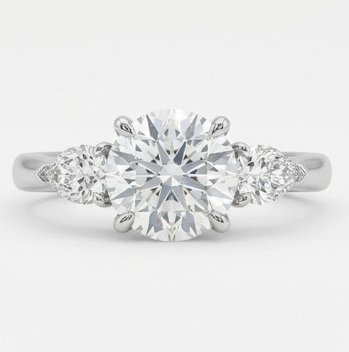5 Ct Lab Grown Diamond Round Three-Stone with Pear Sides Ring in 14K White Gold: Title: 5 Ct Lab Grown Diamond Round Three-Stone with Pear Sides Ring in 14K White Gold Description: Stunning 5 carat lab grown diamond ring featuring a Round Three-Stone with Pear Sides design. The ce